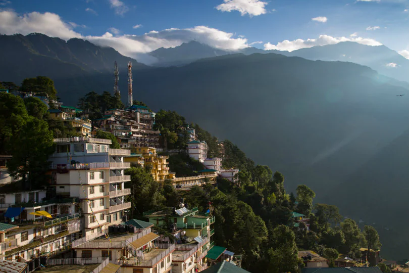 Dharamshala cricket stadium with the Dhauladhar mountains in the background.