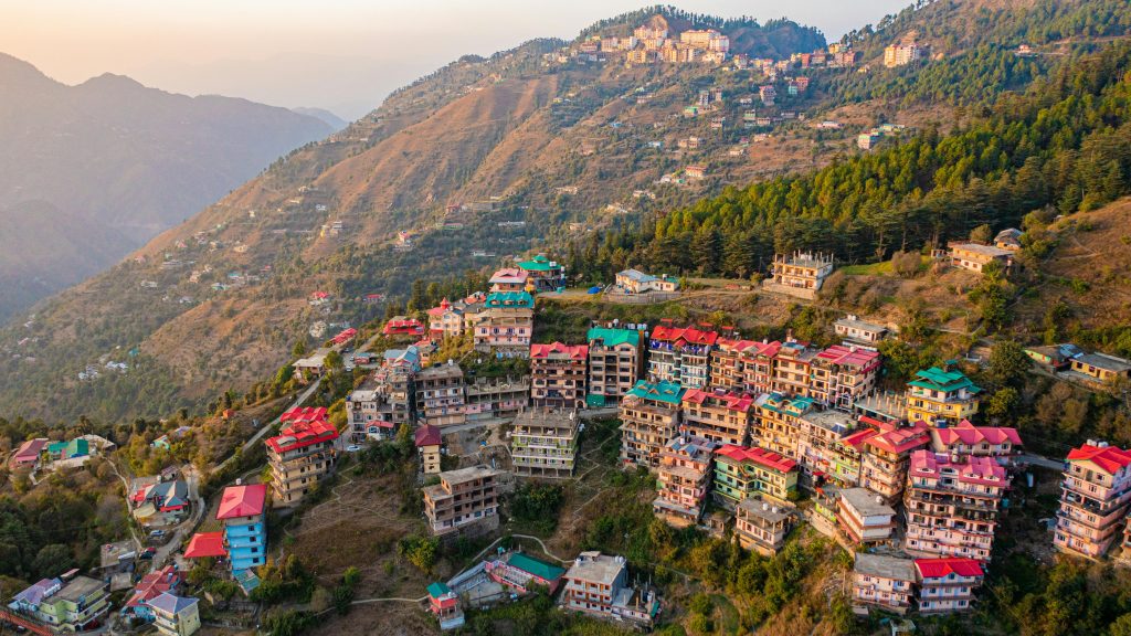View of Shimla Ridge with Christ Church in the evening glow, families walking around the open space.